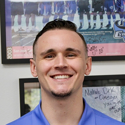 Chiropractor Zack Fulks Smiling In Polo Shirt