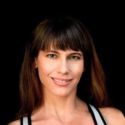 Certified Massage Therapist Nicole Dowell Smiling In Tank Top