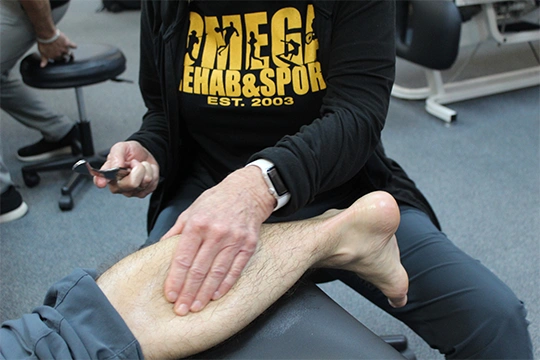 Patient Receiving Tissue Therapy On Leg