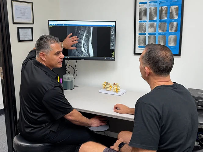 Sevak Khodabakhshian Going Over X-Rays with Patient