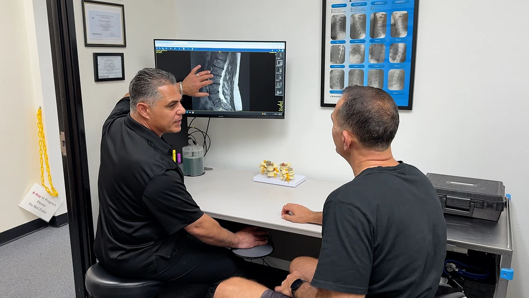 Sevak Khodabakhshian Going Over X-Rays with Patient